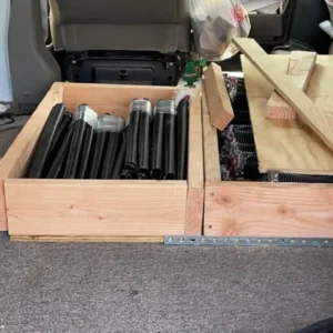 Garage Door Components and Springs Organized in Storage Crate