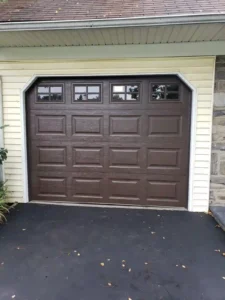 Dark brown garage door with window inserts - Garage Door Installation San Antonio TX